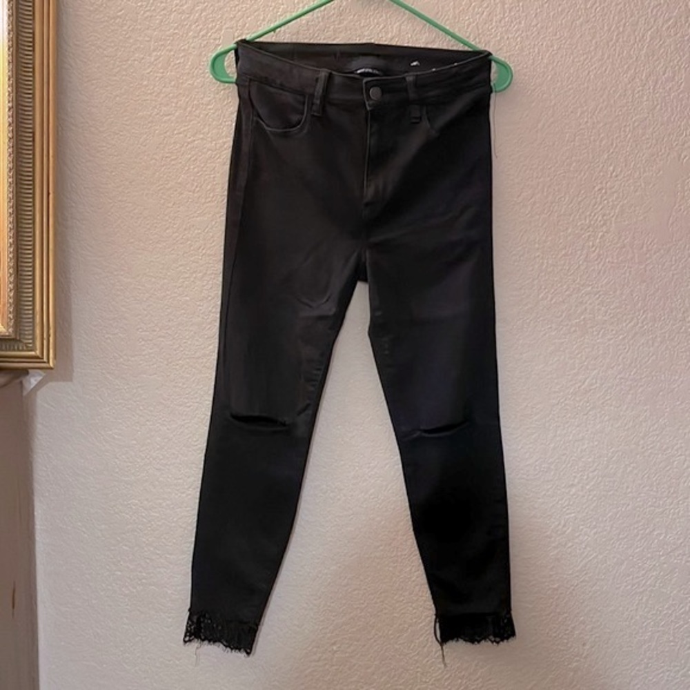 American Eagle skinny black jeans with rips in the knees